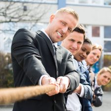 Businesspeople Pulling Rope Group Of Multiethnic Businesspeople Pulling Rope Playing Tug Of War